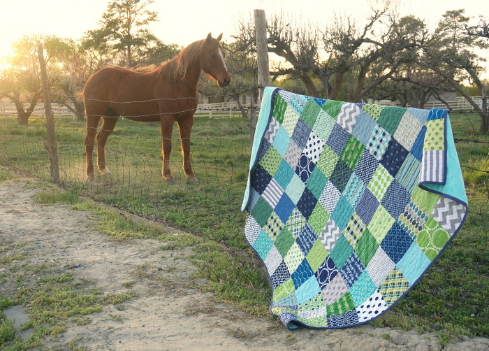 Green and Blue patchwork quilt with a horse