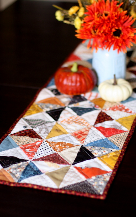 Hourglass Quilt Block Shortcut Video Tutorial by popular Utah quilting blog, Diary of a Quilter: image of a table runner with the hourglass quilt block.