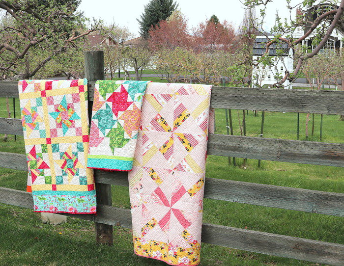 Free Video Class: Strip Piecing Quilt Patterns by popular Utah quilting blog, Diary of a Quilter: image of 3 strip piecing quilts hanging over a wooden fence.