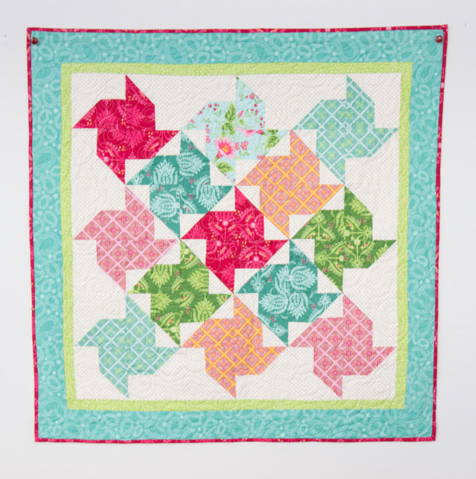 Free Video Class: Strip Piecing Quilt Patterns by popular Utah quilting blog, Diary of a Quilter: image of a spinning stars quilt.