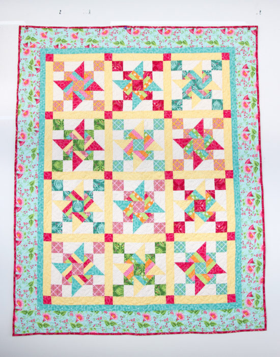 Free Video Class: Strip Piecing Quilt Patterns by popular Utah quilting blog, Diary of a Quilter: image of an hourglass pinwheel quilt.