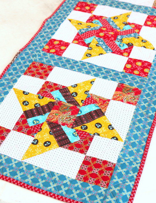 Free Video Class: Strip Piecing Quilt Patterns by popular Utah quilting blog, Diary of a Quilter: image of a spinning stars quilt.