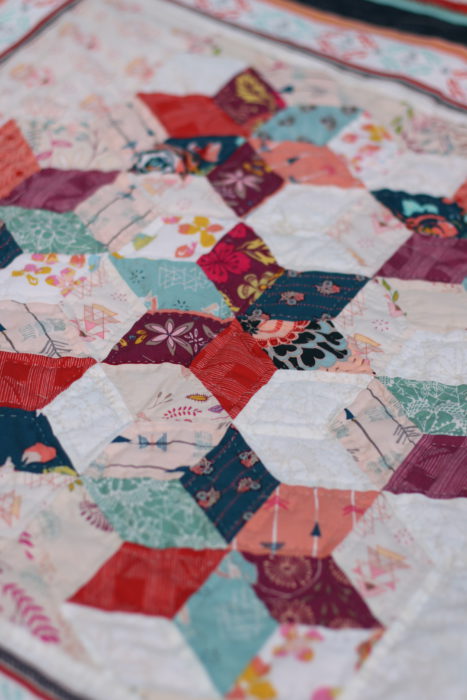 Mini quilt featuring six 60-degree diamond star blocks sewn into a hexagon layout.