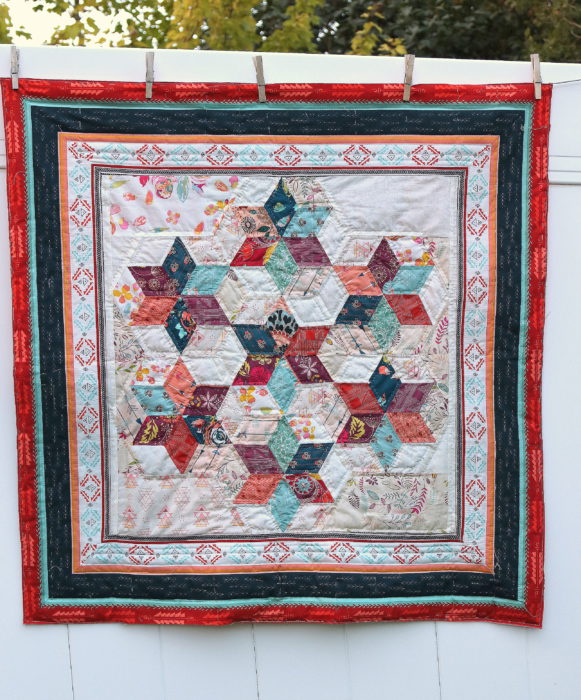 Mini quilt featuring six 60-degree diamond star blocks sewn into a hexagon layout.