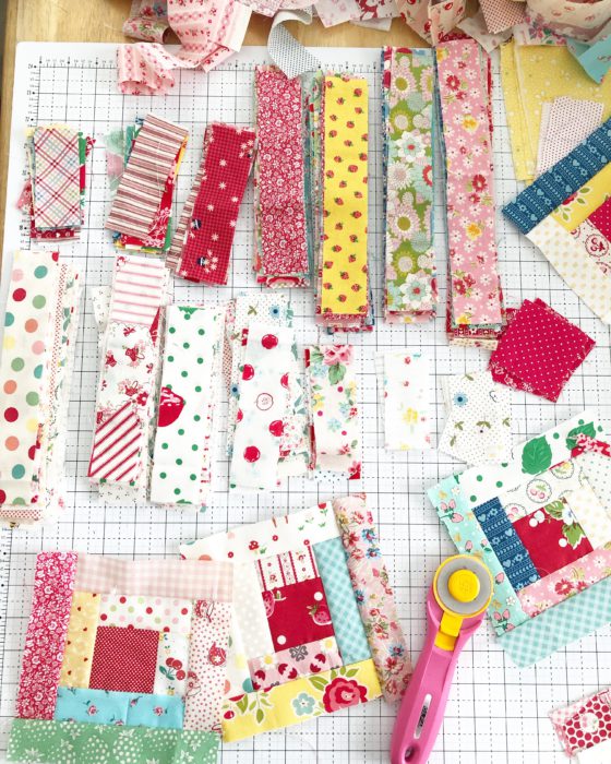 Use fabric scraps to piece a Log Cabin quilt
