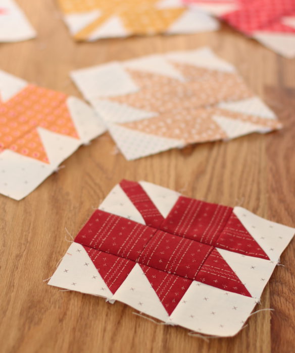 Classic Maple Leaf Quilt Block Tutorial by popular Utah quilting blog, Diary of a Quilter: image of individual maple leaf quilt blocks spread out on a table.