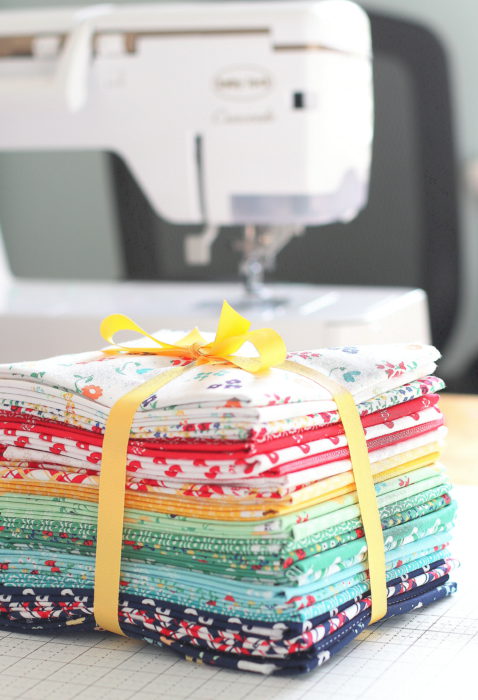 Sugarhouse Park fabric collection by Amy Smart for Riley Blake Designs | Delayed Pine Hollow Pattern by popular quilting blog, Diary of a Quilter: image of a Sugarhouse Park fabric bundle.