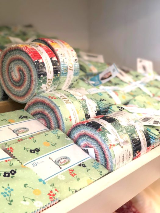 Birthday Bash at Missouri Star Quilt Company by popular quilting blog, Diary of a Quilter: image of fabric jelly rolls at the Missouri Star Quilt Company.