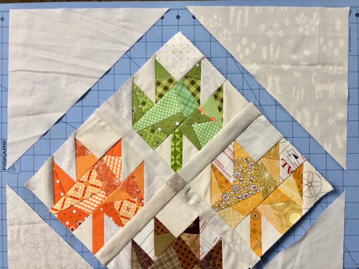 Scrappy Maple Leaf Quilt Pattern Tutorial by guest writer Leila Gardunia by popular quilting blog, Diary of a Quilter: image of scrappy maple leaf quilt. 