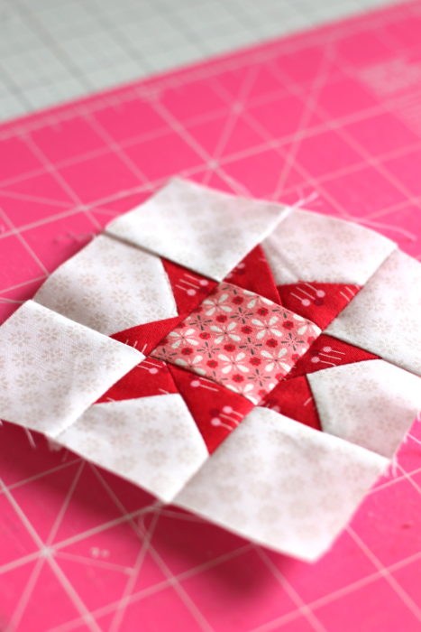Pine Hollow Quilt Along Week 5 by popular quilting blog, Diary of a Quilter: image of a red and white quilting block.