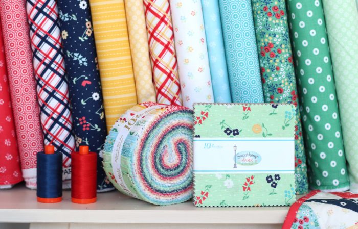 Sugarhouse Park Fabric Collection by Amy Smart by popular Utah quilting blog, Diary of a Quilter: image of Sugarhouse Park fabric bolts, fat quarter bundles, and jelly rolls. 