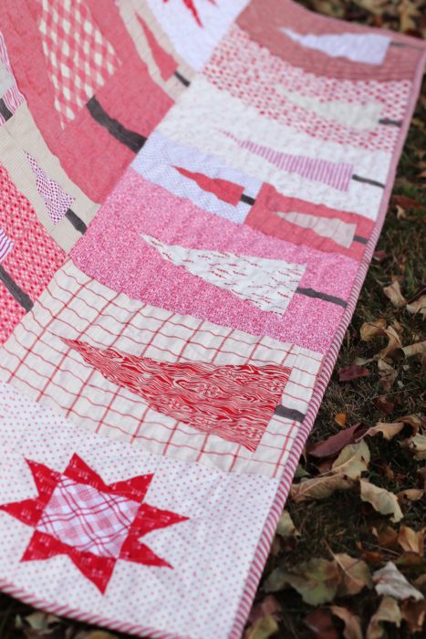 Pine Hollow Patchwork Forest Quilt, a Christmas Quilt featured by top US quilting blog, Diary of a Quilter