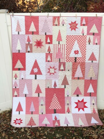 Pine Hollow Patchwork Forest Quilt, a Christmas Quilt featured by top US quilting blog, Diary of a Quilter