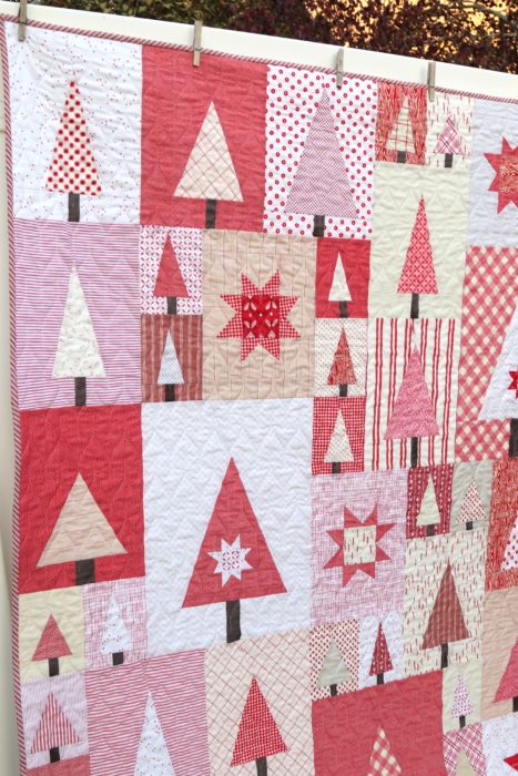 Pine Hollow Patchwork Forest Quilt, a Christmas Quilt featured by top US quilting blog, Diary of a Quilter