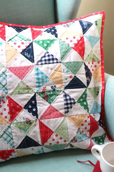 Hourglass Quilt Block Shortcut Video Tutorial by popular Utah quilting blog, Diary of a Quilter: image of a pillow cover with the hourglass quilt block.