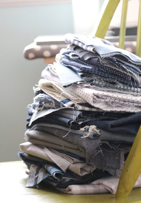 Stack of denim, gingham, and other woven blue fabrics