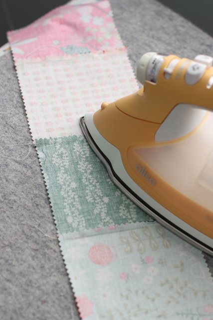 How to Make a Patchwork Baby Quilt with Precuts, a tutorial featured by top US quilting blogger, Diary of a Quilter