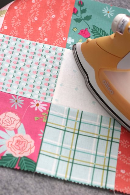 How to Make a Patchwork Baby Quilt with Precuts, a tutorial featured by top US quilting blogger, Diary of a Quilter