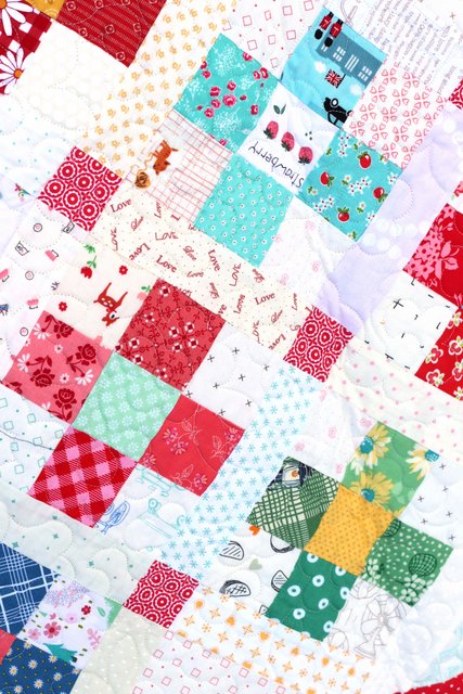 Scrap quilt perfect for fussy-cut squares and for using low-volume prints
