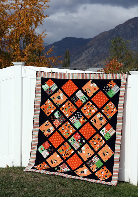 "Halloween Lattice Quilt” is a Free Halloween Lap Quilt Pattern designed by Amy Smart from Diary of a Quilter!