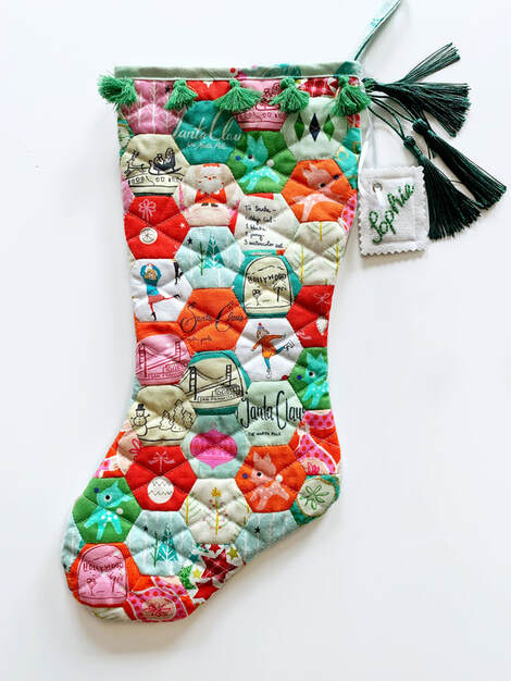 Quilted Stocking made from EPP fussy-cut hexagons by Joe June and Mae
