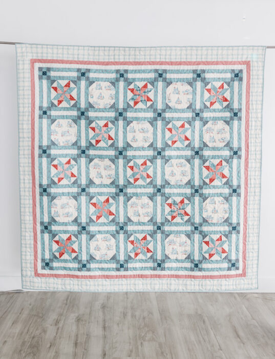 Nautical red, white, and blue quilt made by Amy Smart pattern New Castle Beach. Reminiscent of New England summers at the seaside. Featuring fabric from the Portsmouth collection by Amy Smart, Diary of a Quilter