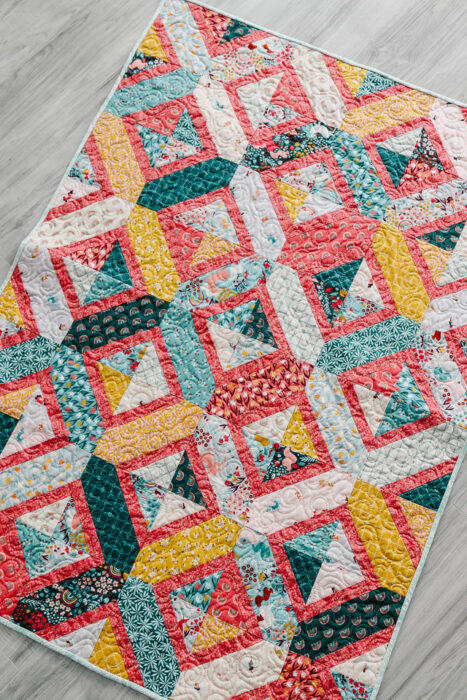 Fat Quarter friendly Crib Quilt Pattern - Double Crossed by Amy Smart made with Fairy Dust Fabric from Riley Blake
