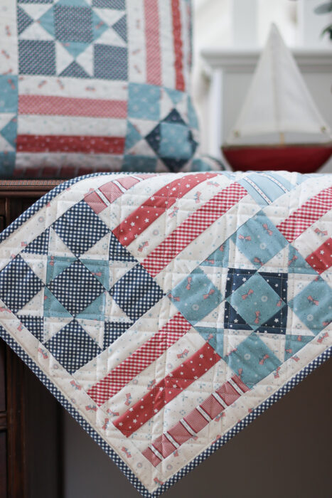 Quilted patchwork Stars and Stripes table runner tutorial perfect for the 4th of July. Featuring Portsmouth Fabric from Riley Blake Designs.