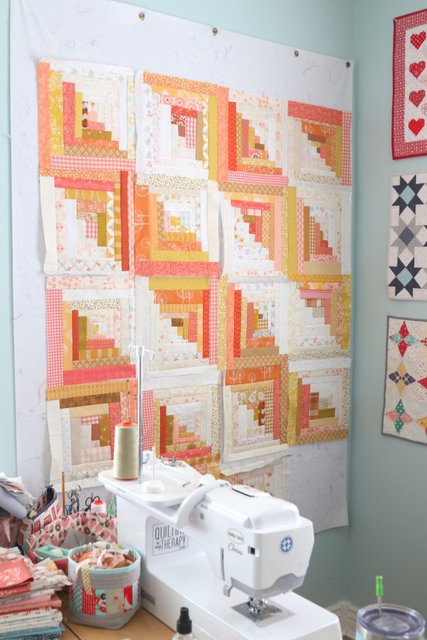 Fun with scraps - improv log cabin quilt blocks.