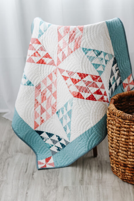 Traditional patchwork star baby quilt - Sugarhouse Star pattern by Amy Smart featuring the Portsmouth fabric collection.