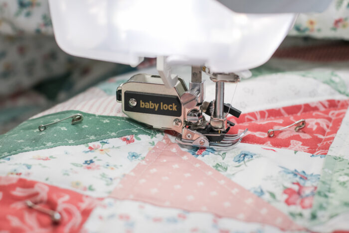 Walking foot quilting over seam intersections to keep quilt layers from shifting