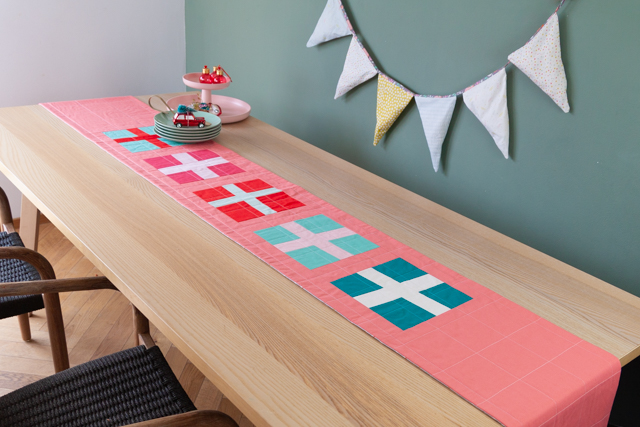 Simple holiday quilted table runner tutorial featuring impro piecing from Designed to Quilt.