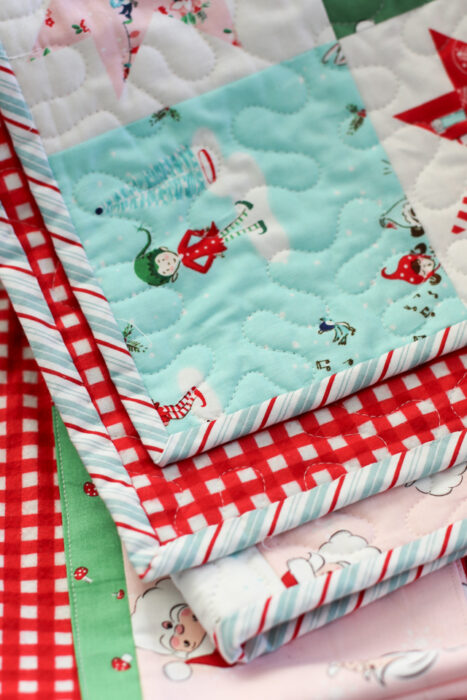 Christmas patchwork quilt made by Amy Smart of Diary of a Quilter featuring prints from Riley Blake Designs