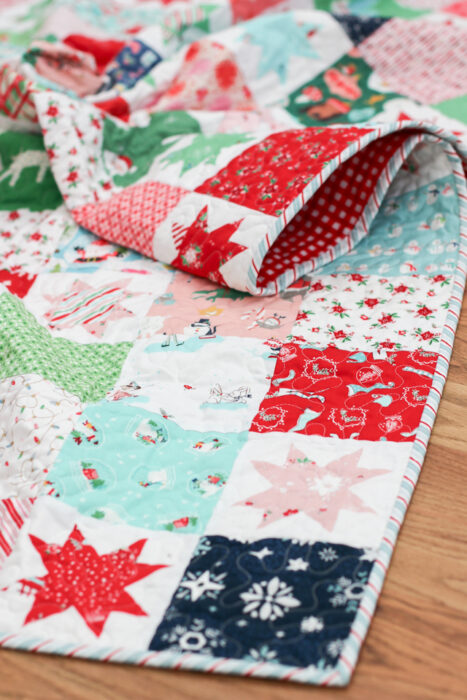 Christmas patchwork quilt made by Amy Smart of Diary of a Quilter featuring prints from Riley Blake Designs