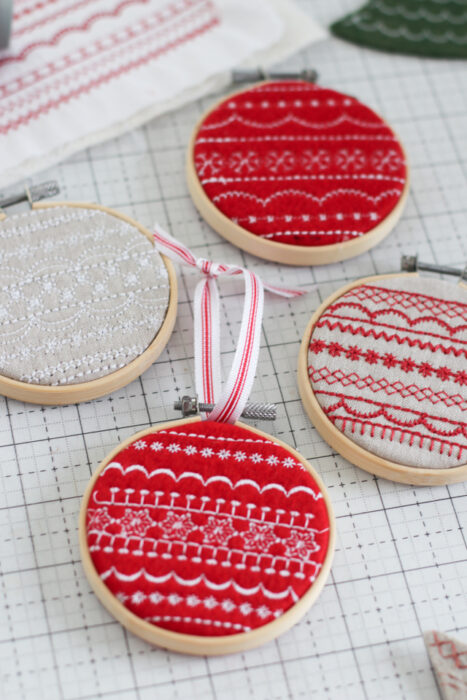 Handmade Christmas hoop-art ornament tutorial made with decorative Baby Lock sewing machine stitches.