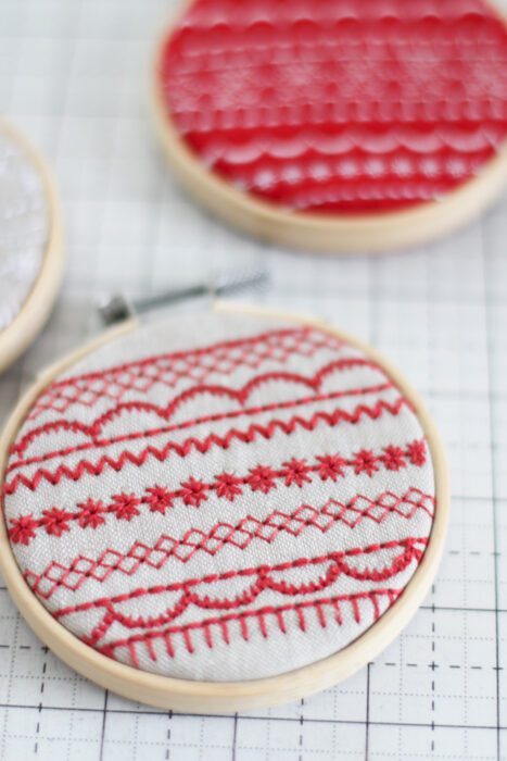 Handmade Christmas hoop-art ornament tutorial made with decorative Baby Lock sewing machine stitches.