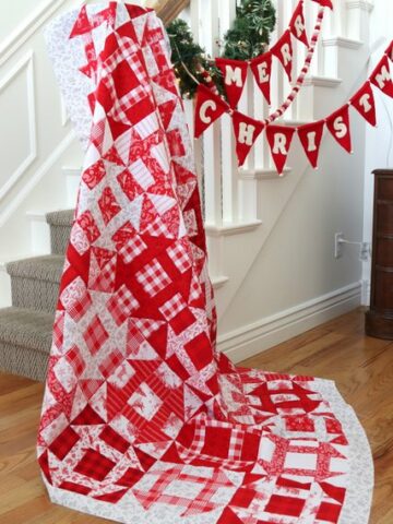 Traditional Red and White churn dash quilt made using Amy Smart's Fast Churn Dash quilt pattern.