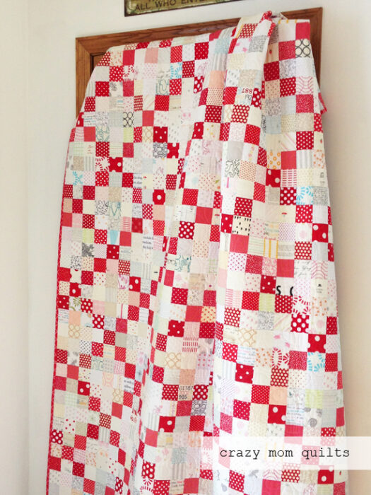 Red and White scrappy nine patch quilt made by Amanda Jean Nyberg of Crazy Mom Quilts