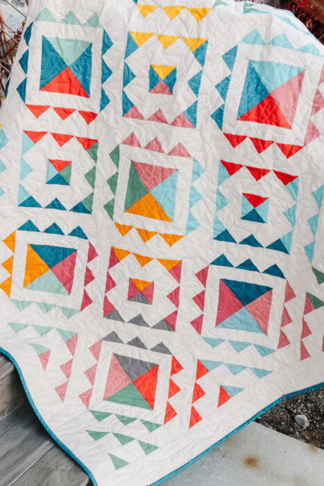 Cascade Falls quilt pattern made with Riley Blake Confetti Cottons and Linen background.