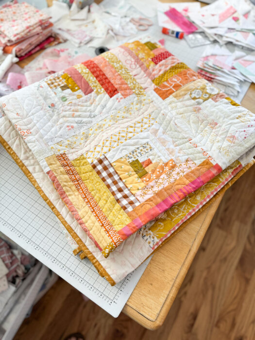 Fresh modern log cabin quilt improv-pieced with favorite scraps