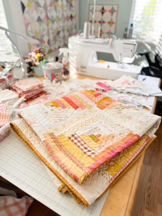 Fresh, modern improv version of a traditional Log Cabin Quilt made with fabric scraps.