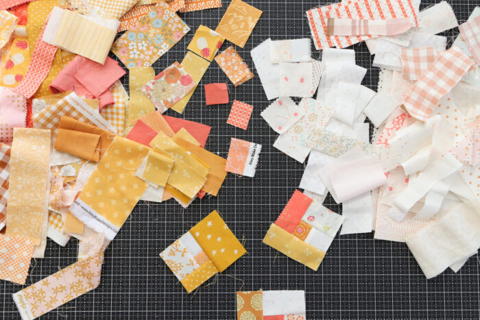 Gold, pink, orange + low-volume fabric scraps