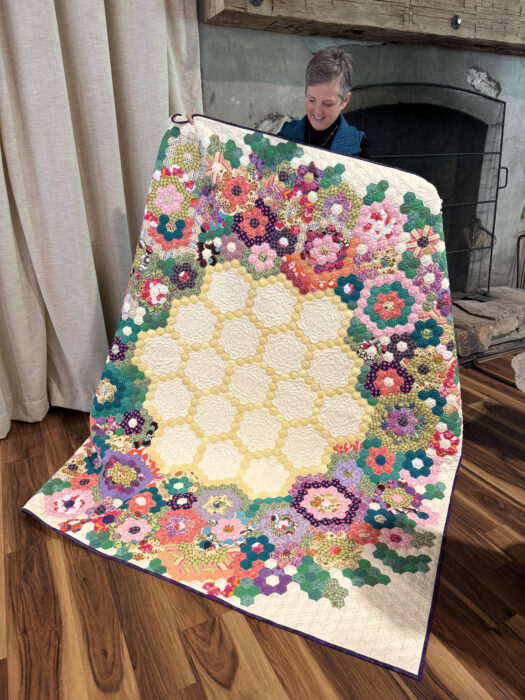 Hand-pieced hexagon quilt made by Honduran women of One Common Thread, machine quilted by Susan Smith
