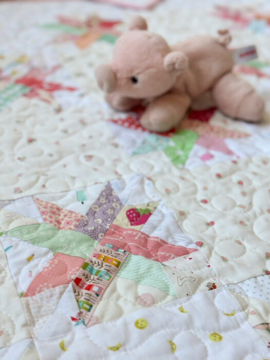 Baby quilt made from Woven Star FPP blocks and lots of low volume Hush Hush prints from Riley Blake.