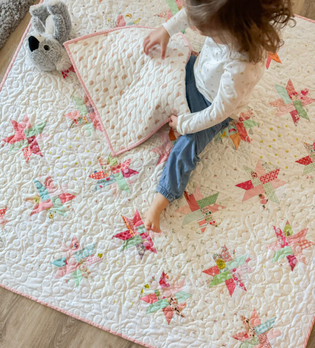 Baby quilt made from Woven Star FPP blocks and lots of low volume Hush Hush prints from Riley Blake.