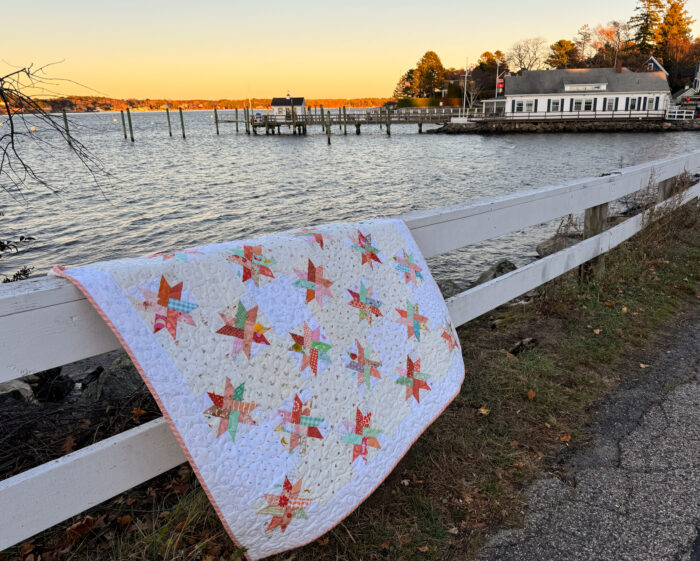 Baby quilt made from Woven Star FPP blocks and lots of low volume Hush Hush prints from Riley Blake.
