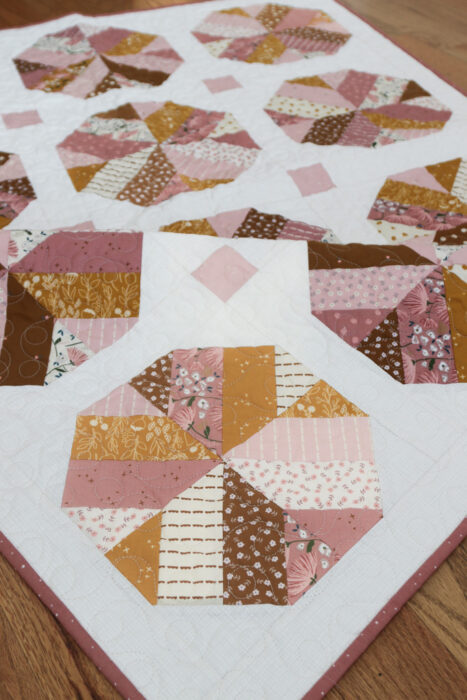 Jelly Roll (aka Rolie Polie) quilt pattern featuring strip cut short cuts designed by Amy Smart