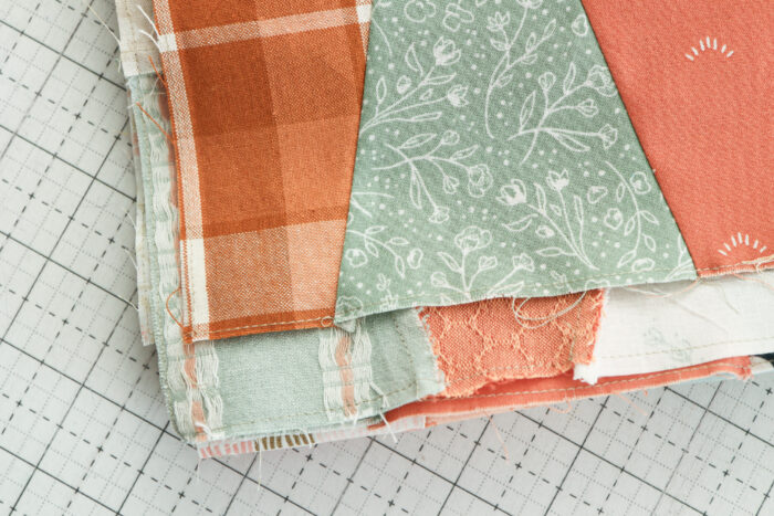 Sew an â…›th inch seam on the edge to prevent quilt seams splitting