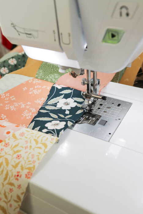Sew an â…›th inch seam on the edge to prevent quilt seams splitting