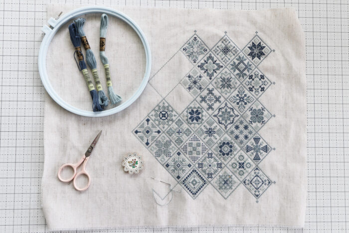 Amish Sampler Cross stitch made by Amy Smart in monochromatic blues
